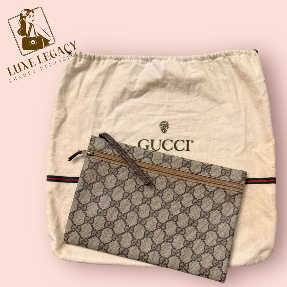 Gucci Monogram wristlet clutch bag